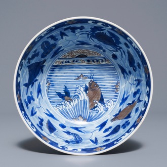 A rare Chinese blue and underglaze red bowl with carps and marine animals, Xuande mark, Kangxi